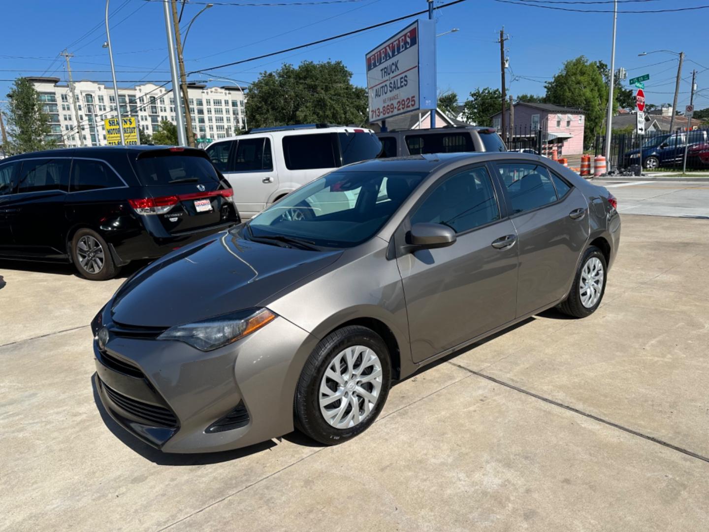 2019 Brown /Gray Toyota Corolla LE (5YFBURHE2KP) with an 1.8L engine, Automatic transmission, located at 1501 West 15th St., Houston, 77008, (713) 869-2925, 29.797941, -95.411789 - Photo#0